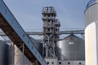  Metal hangar , storage tank silo of wheat and other cereals .  clipart